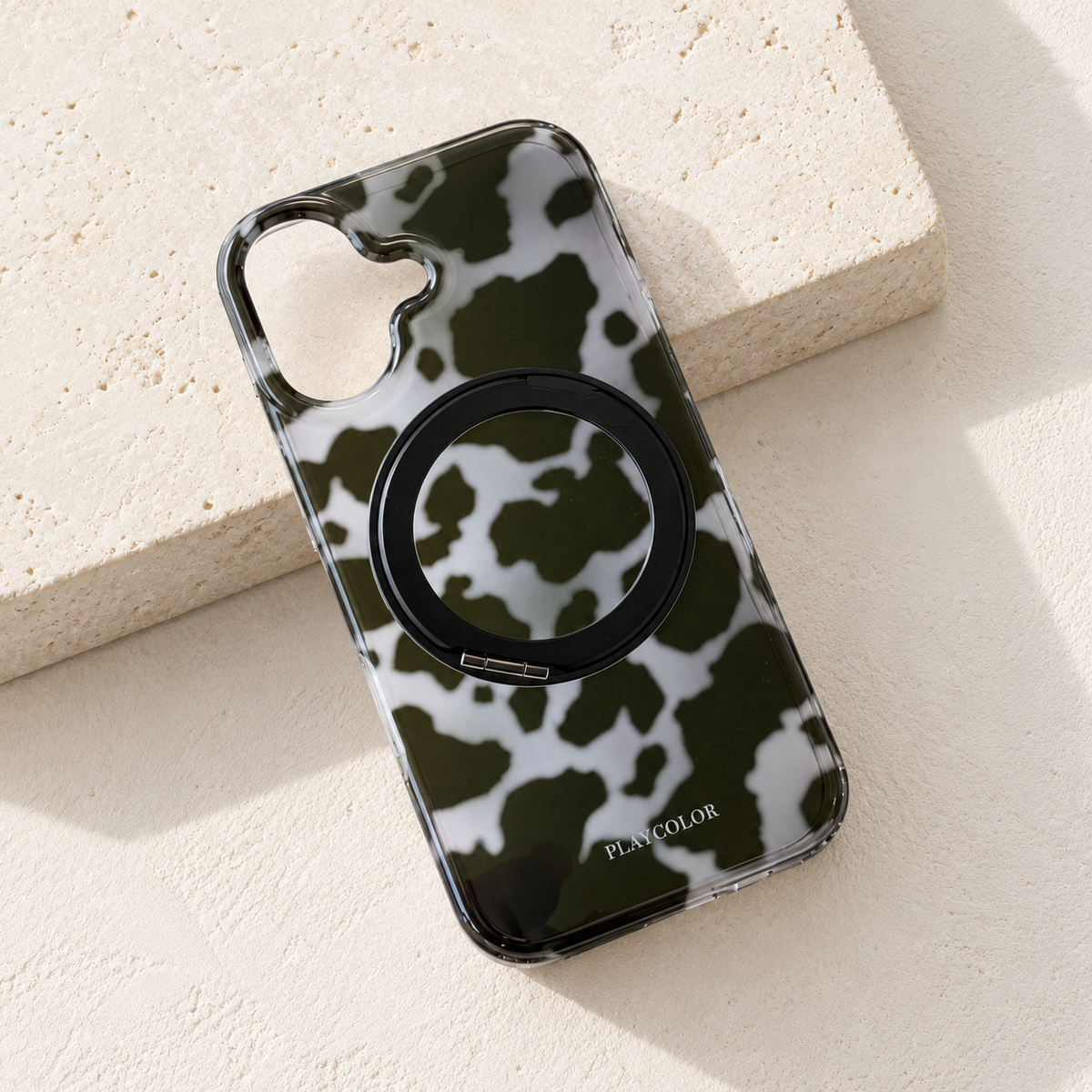 Grey tortoiseshell ring stand case shown without a phone and with its ring folded flat.