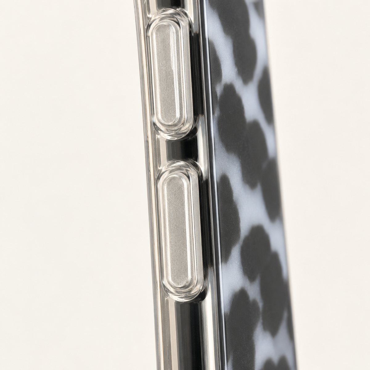 Close detail of the Grey tortoiseshell case's clear-looking side edge and controls.