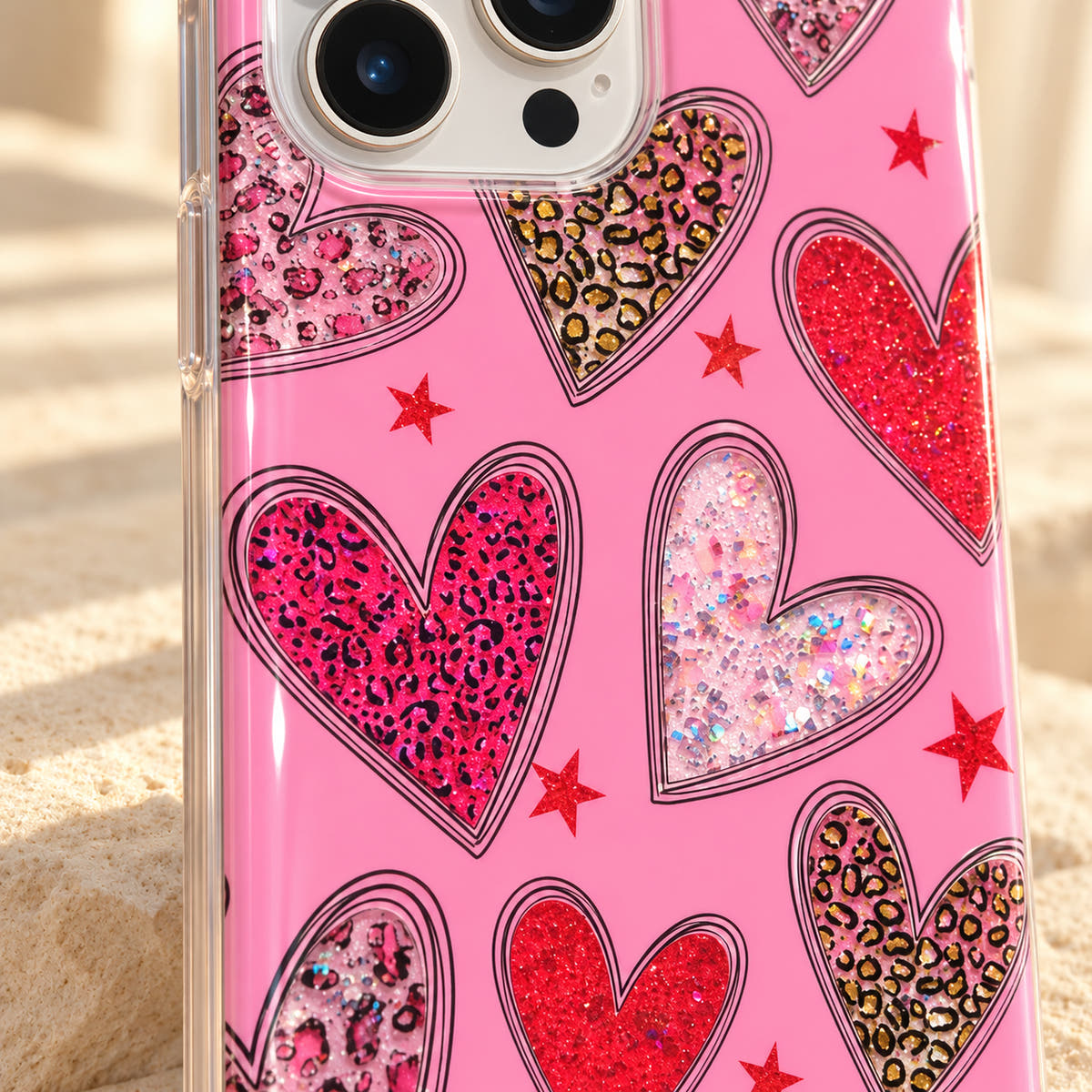 Detail of the bright-pink leopard and pale iridescent heart prints on the Valentina Sparkle Heart iPhone case.