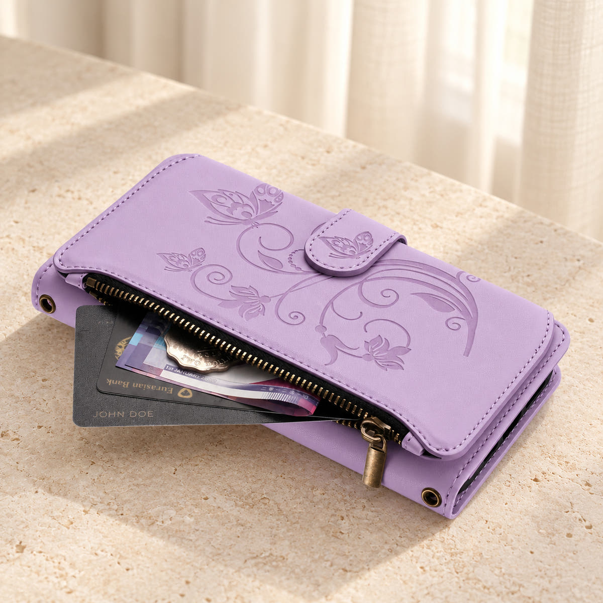 Velora Zip wallet case in Lavender on cream limestone, showing the embossed front and open side zip pocket with cards and cash.