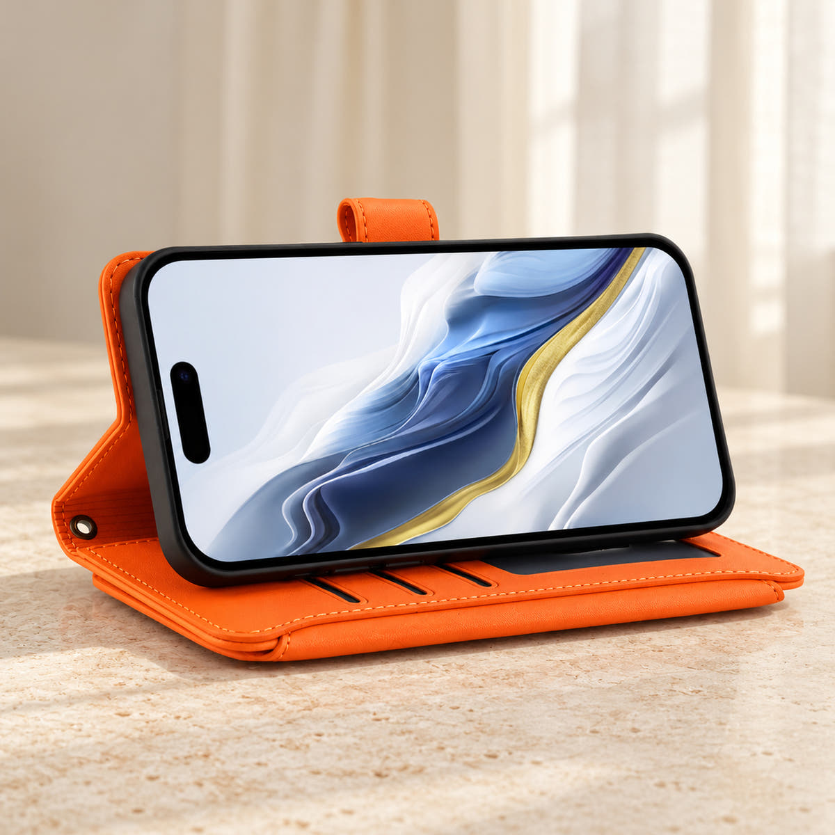 Velora Zip wallet case in Orange folded into a landscape viewing stand on cream limestone.