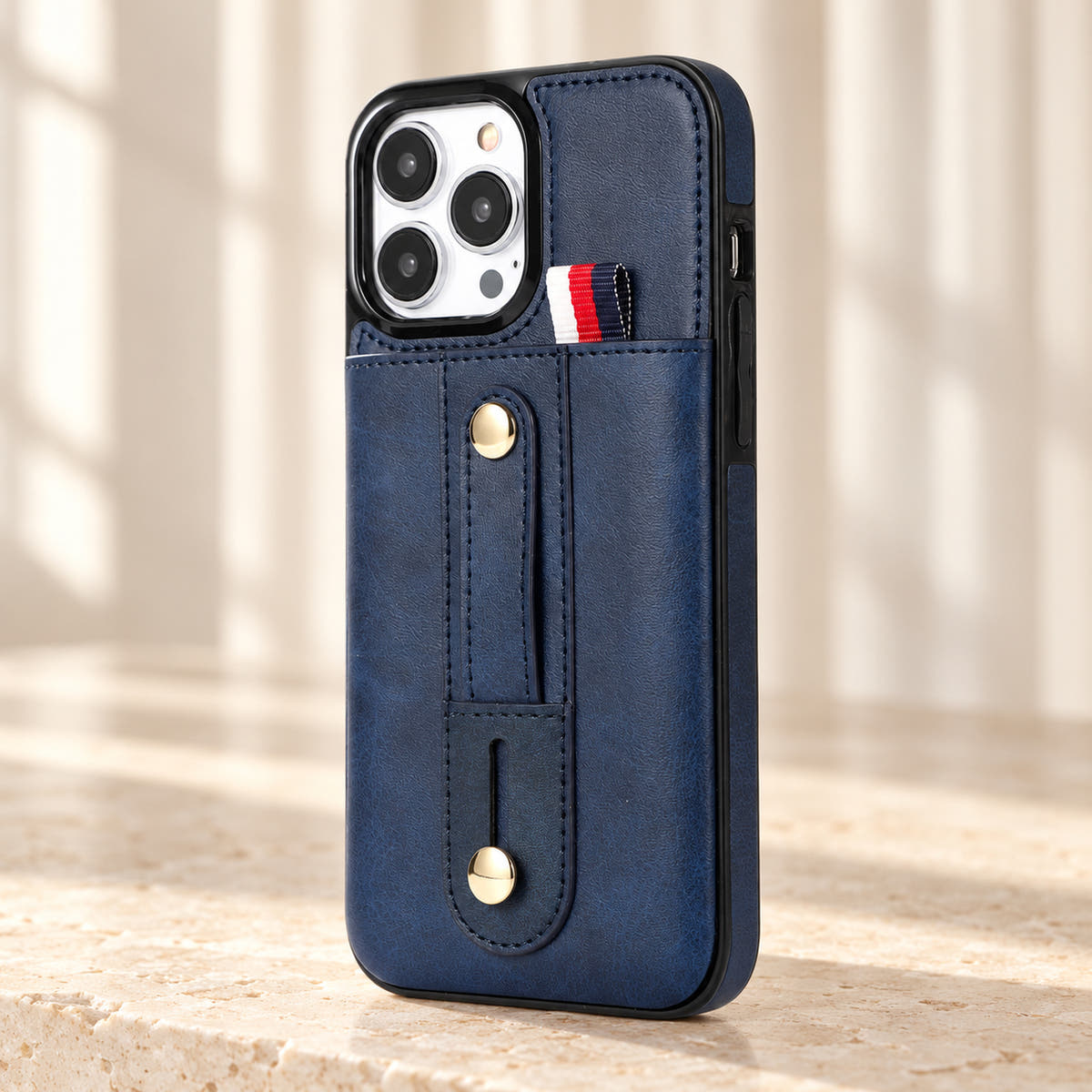 Navy Blue iPhone wallet case with card pocket and adjustable hand strap, detail