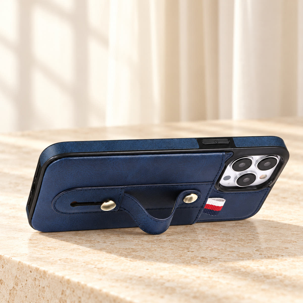 Navy Blue iPhone wallet case with card pocket and adjustable hand strap, stand