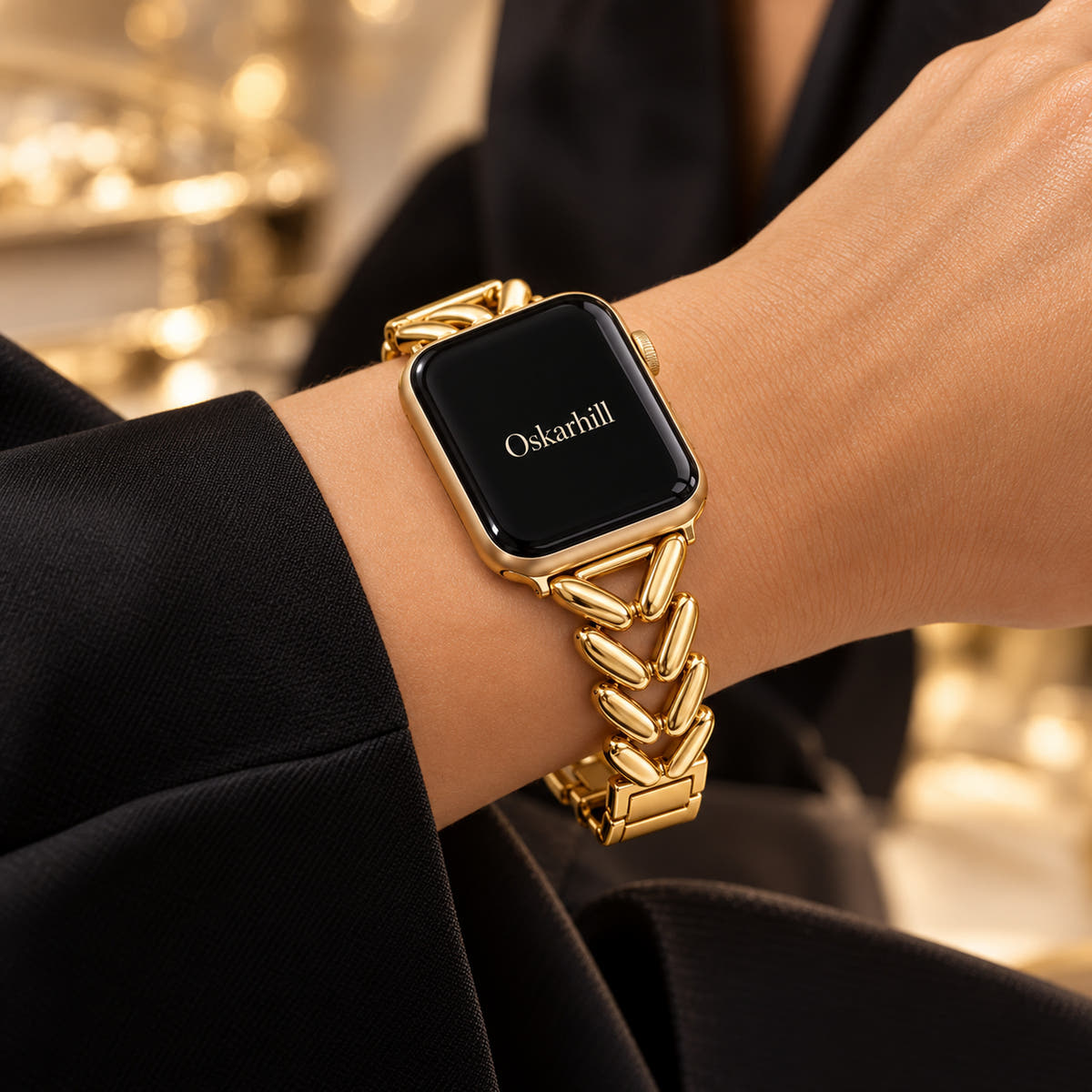 Monelle gold Apple Watch bracelet worn with a black sleeve for evening styling