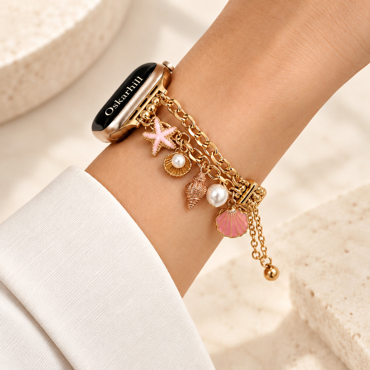 Side view of Mariselle pink shell and starfish Apple Watch bracelet on a wrist