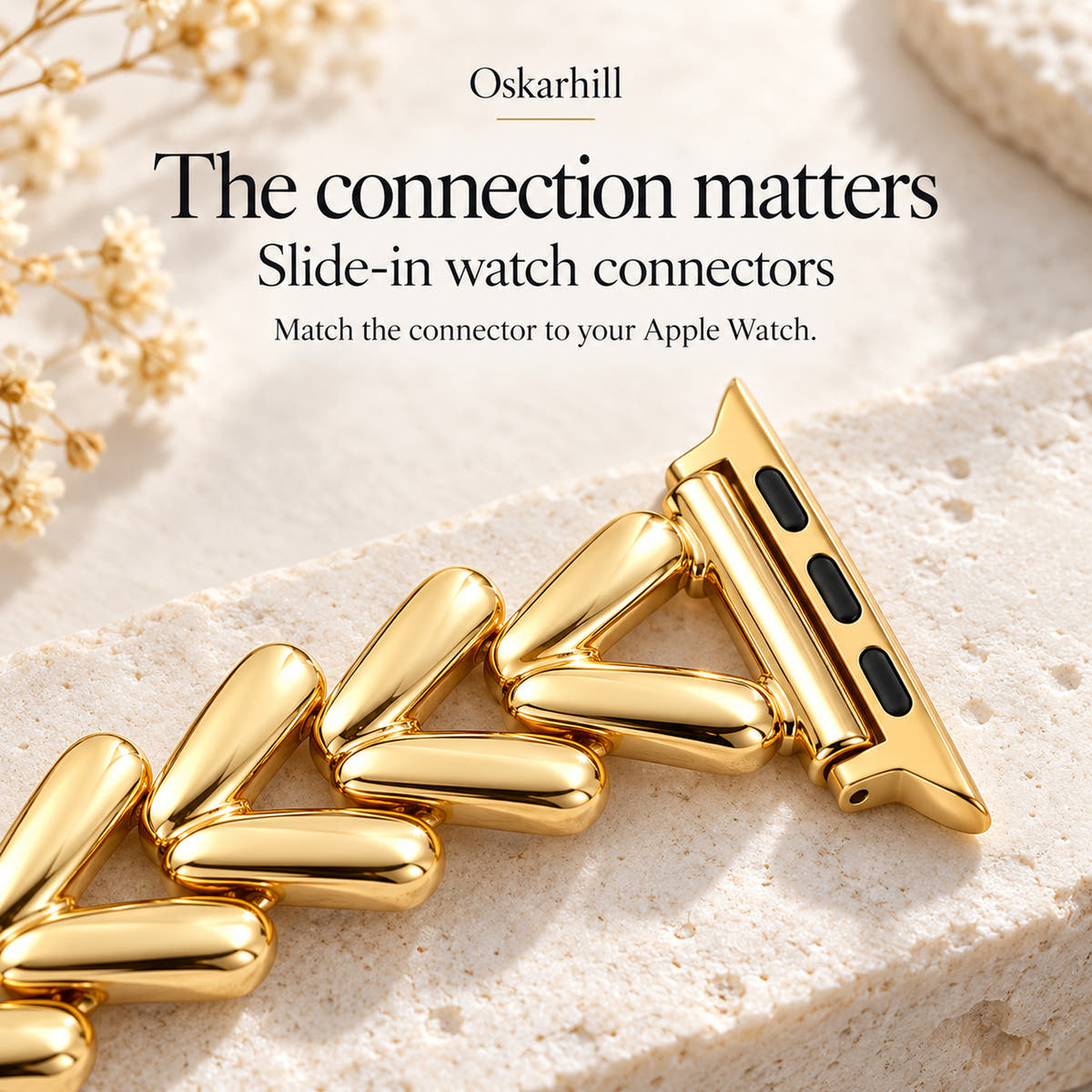 Close-up of the Monelle gold slide-in Apple Watch connector and chevron links