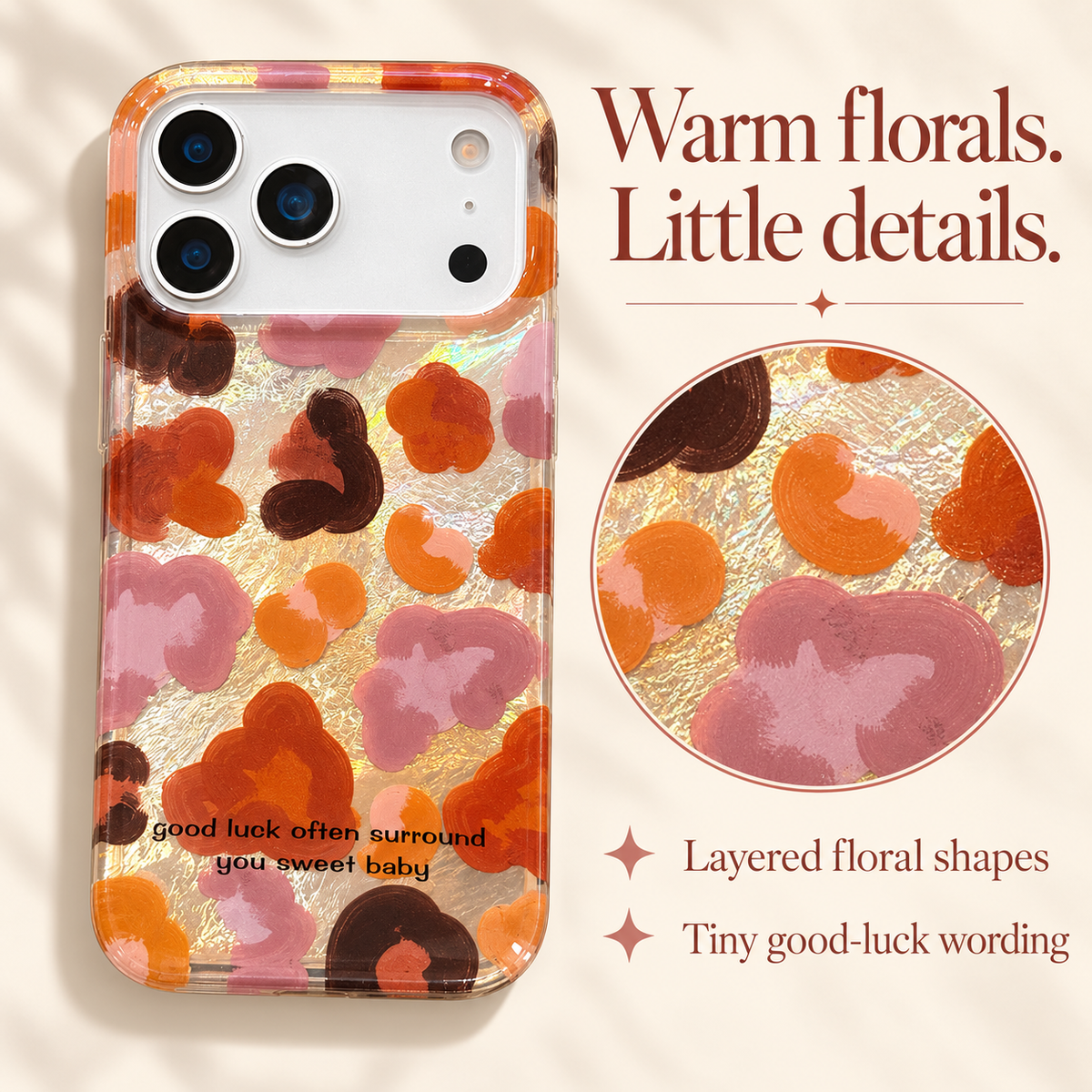 Full Autumn Mix floral case beside a circular magnified view of its layered warm floral shapes and callouts for the print and tiny good-luck wording.