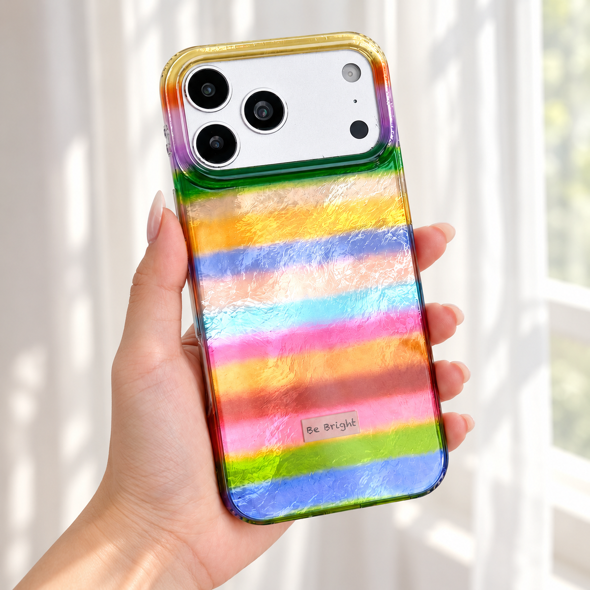Be Bright rainbow stripe iPhone case — rainbow finish in daylight.