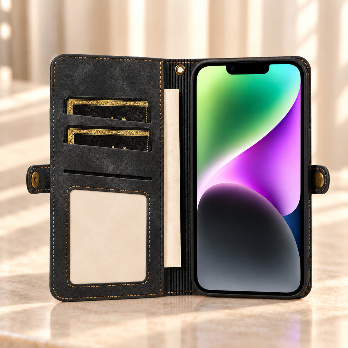 Open Black BlushCarry wallet phone case showing inner card storage, a rectangular photo window, notes pocket and bronze-tone snap tabs.