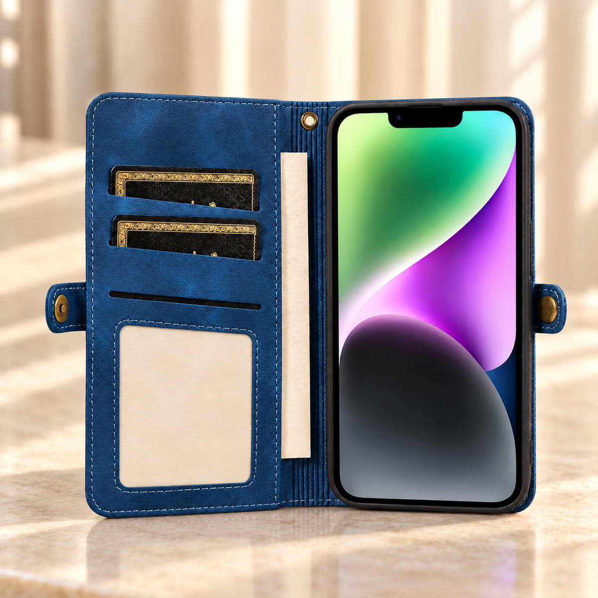 Open Navy Blue BlushCarry wallet phone case showing inner card storage, a rectangular photo window, notes pocket and bronze-tone snap tabs.