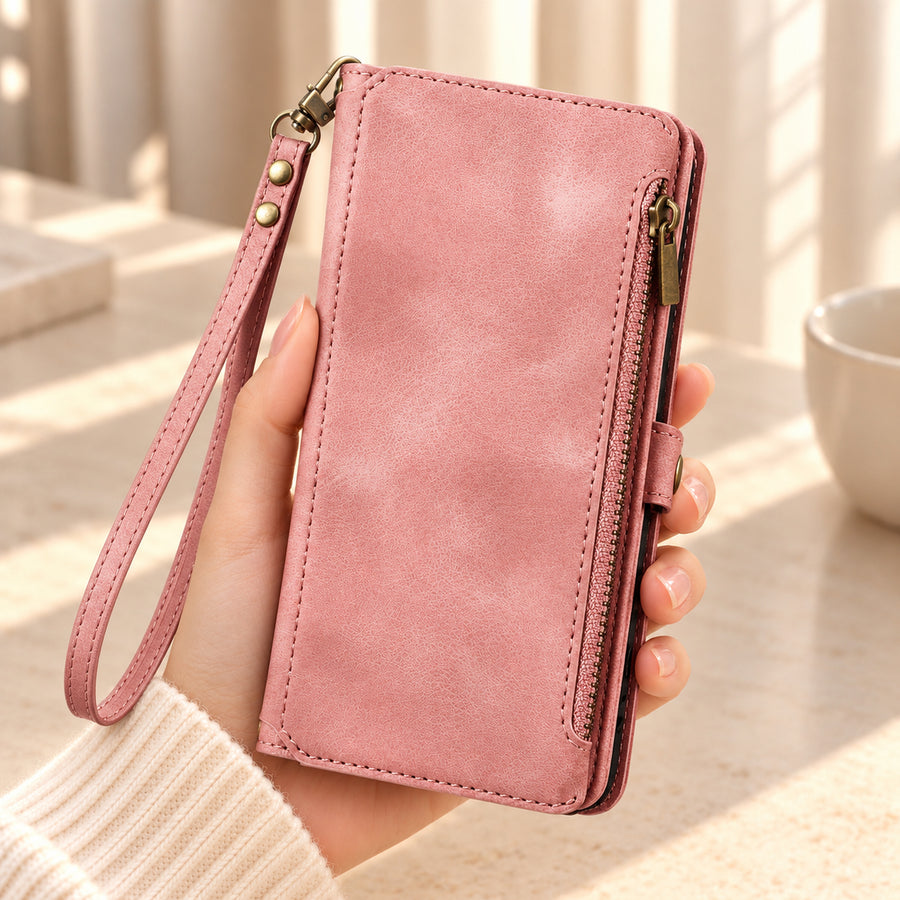 BlushCarry Pink wallet phone case held in one hand, showing its plain textured cover, straight edge zip pocket and matching wrist strap.