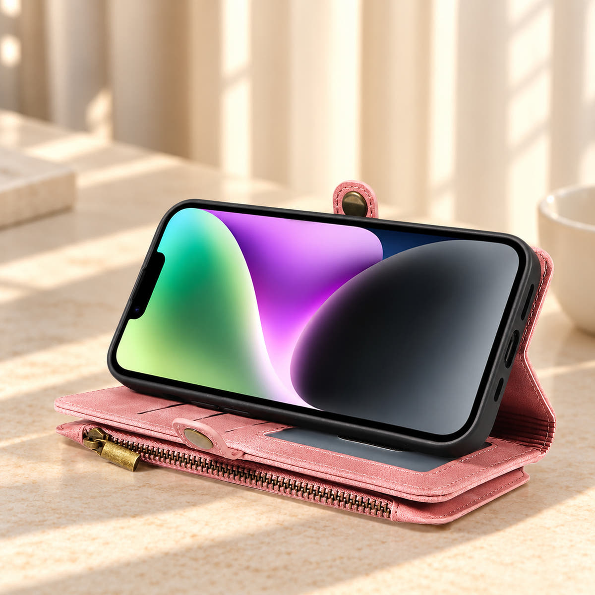 Pink BlushCarry wallet phone case folded into a landscape viewing stand with its edge zip pocket visible.