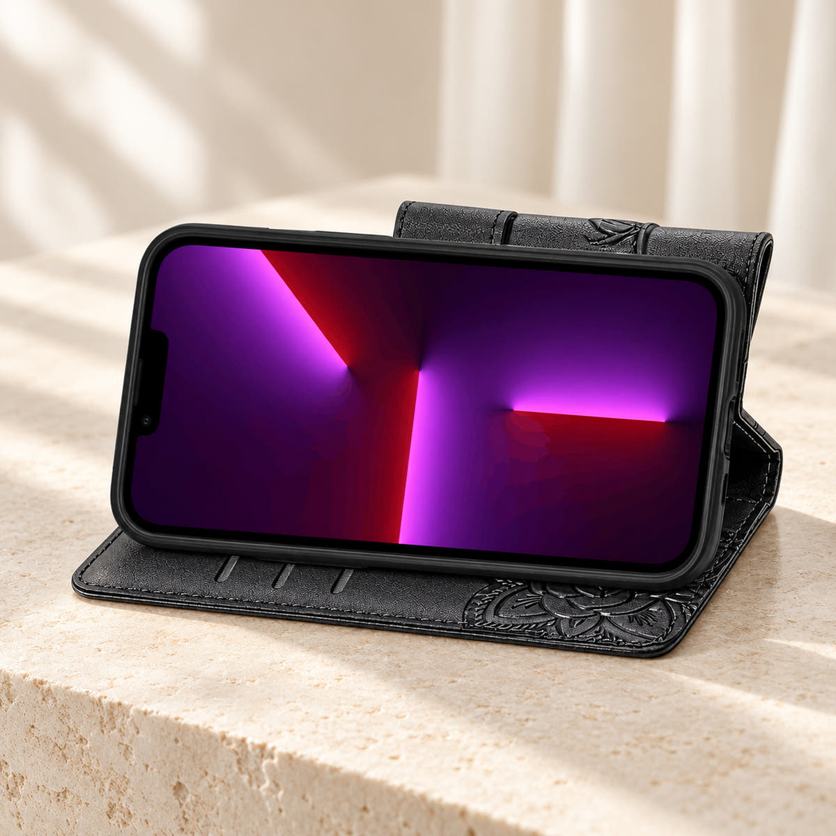 Butterfly iPhone wallet case in Black folded into its landscape stand, with the original interior card-slot edges visible.