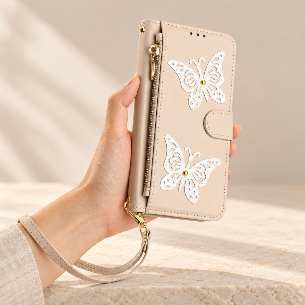 Beige Butterfly iPhone wallet case — front view with wrist strap