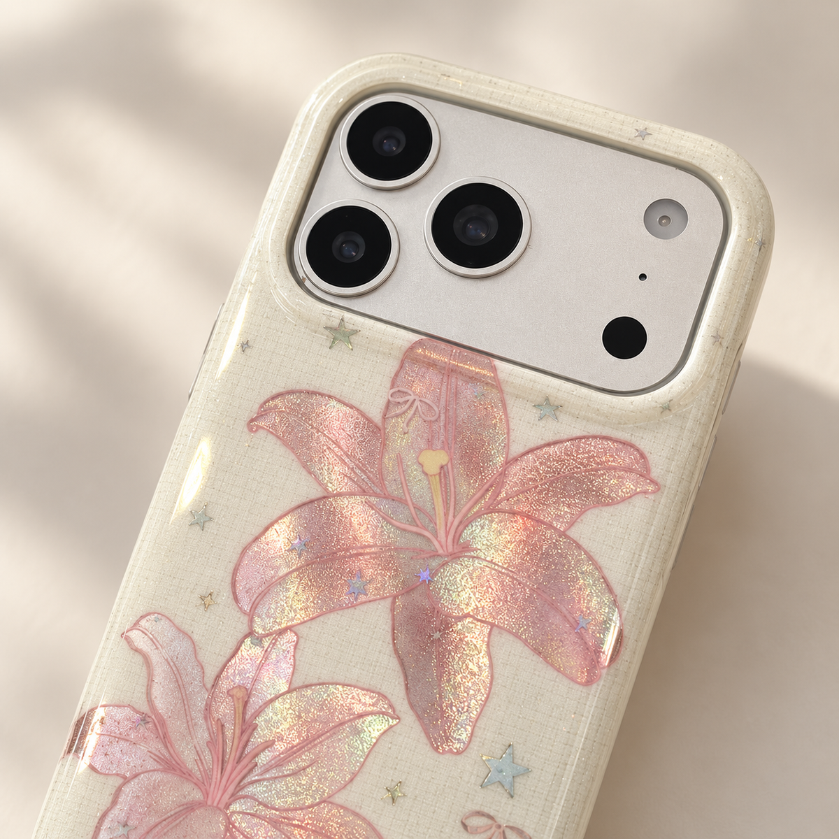Upper rear angle showing the Blush Lily case's pale cream camera rim.