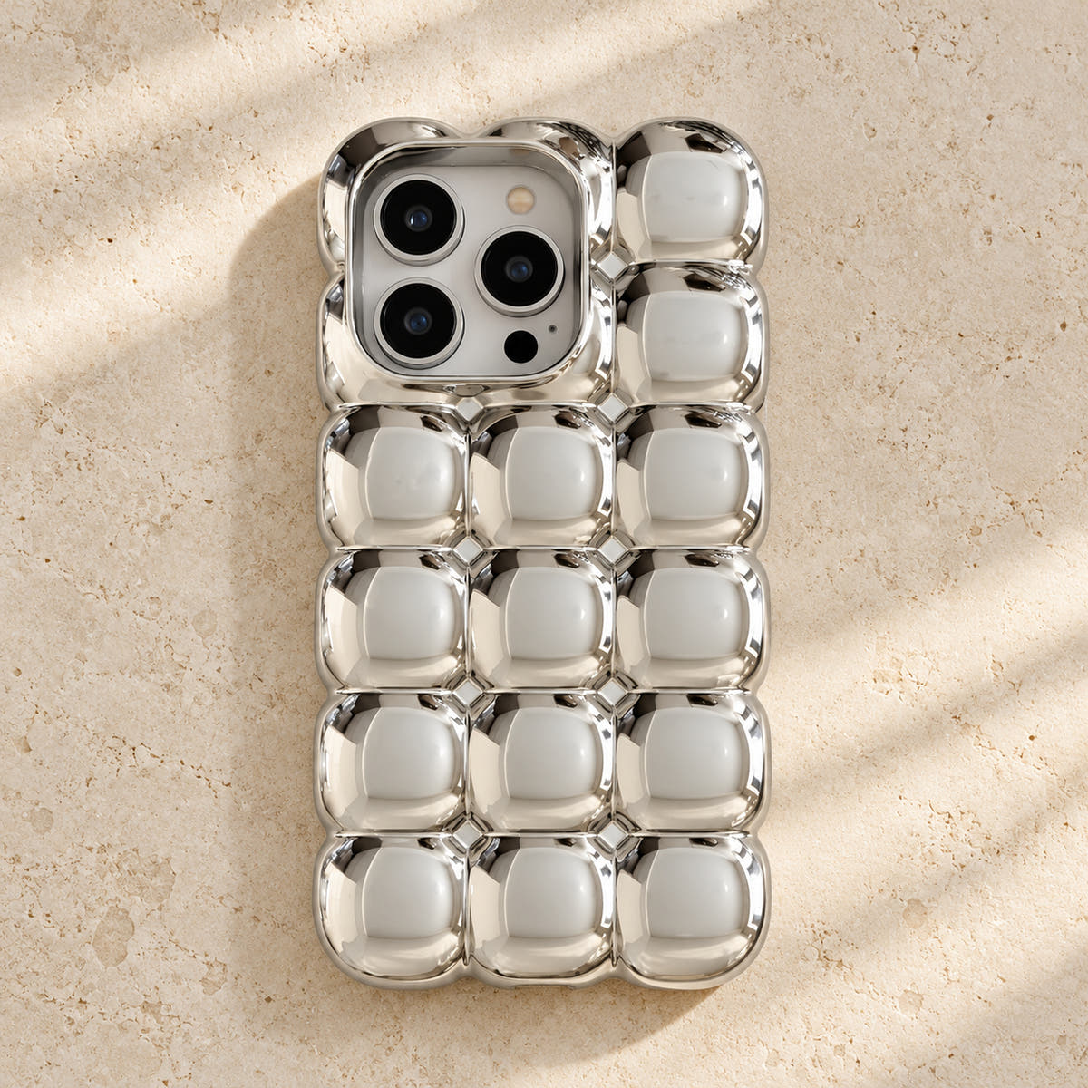 Silver Chrome Bubble Bear iPhone case — flatlay view