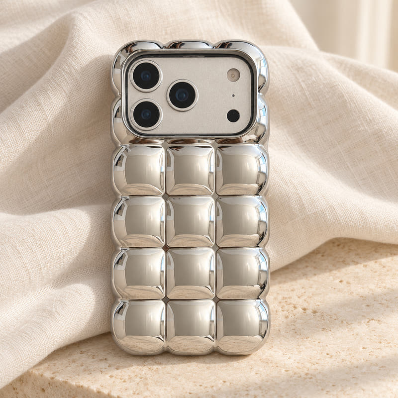 Silver Chrome Bubble Bear iPhone case — linen flatlay view