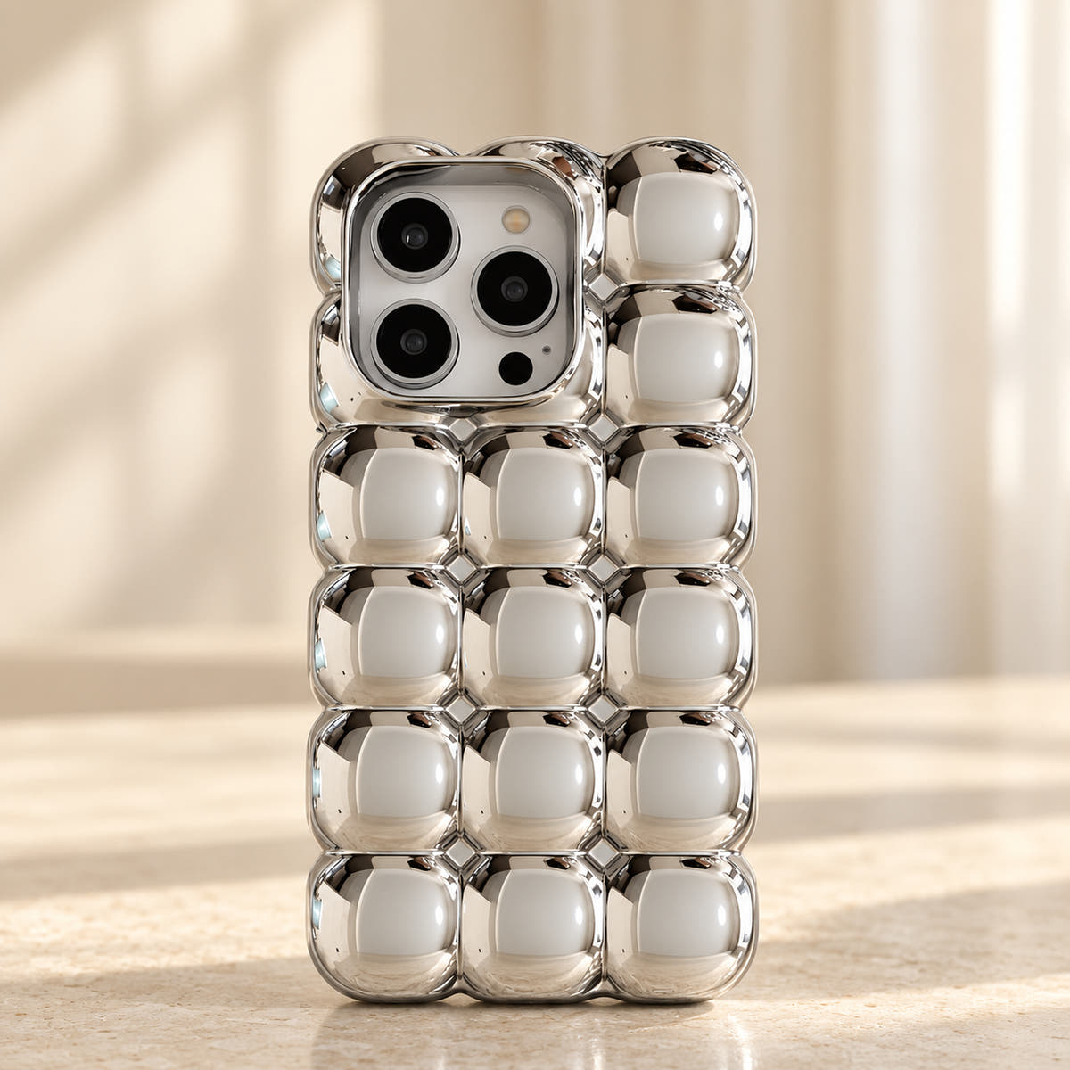 Silver Chrome Bubble Bear iPhone case — upper detail view