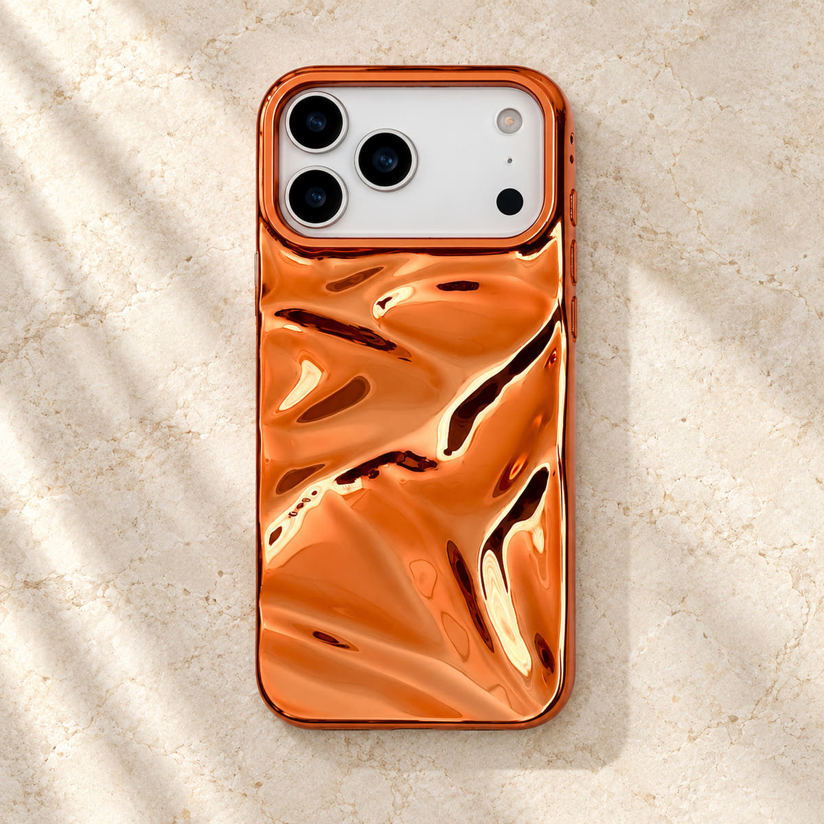 Copper-orange Chrome Wave iPhone case — flatlay view