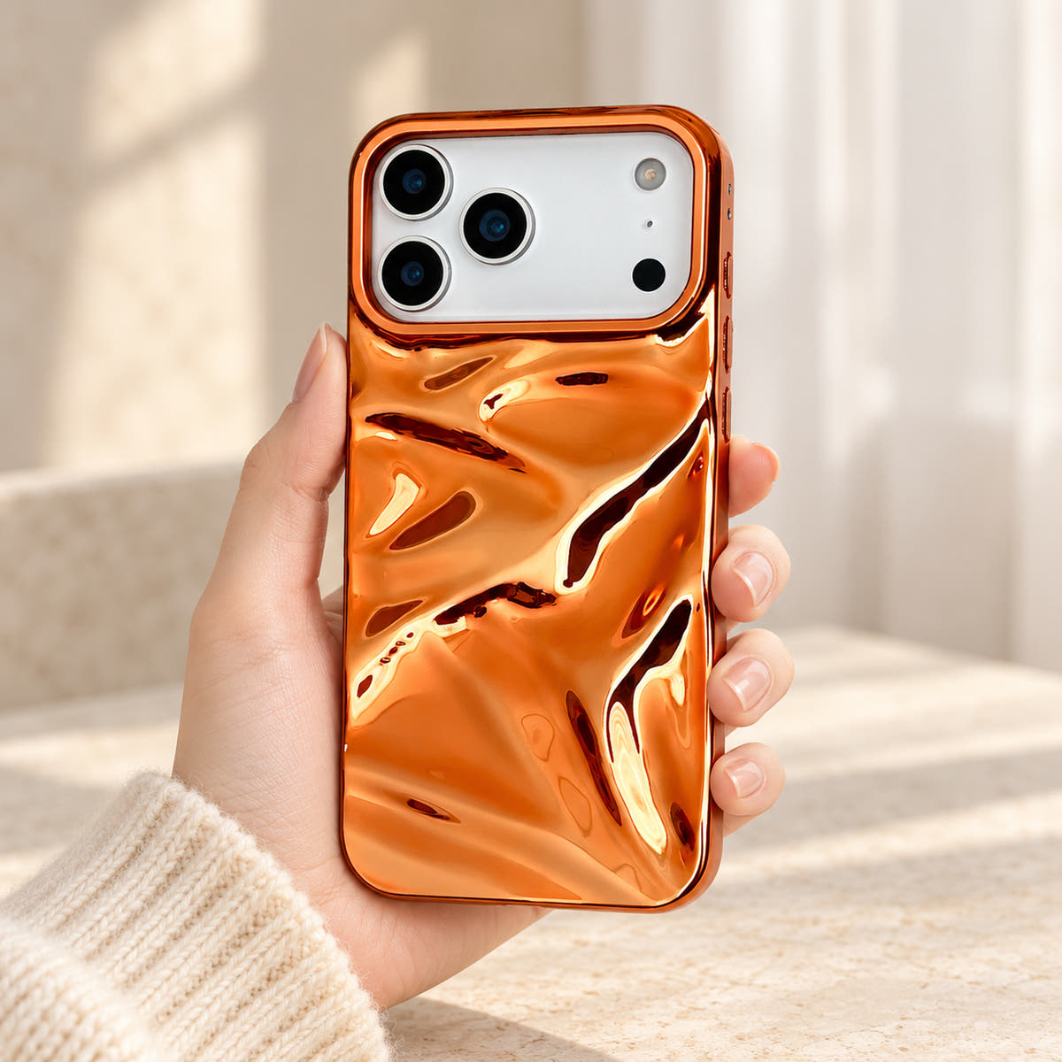 Copper-orange Chrome Wave iPhone case — handheld front view