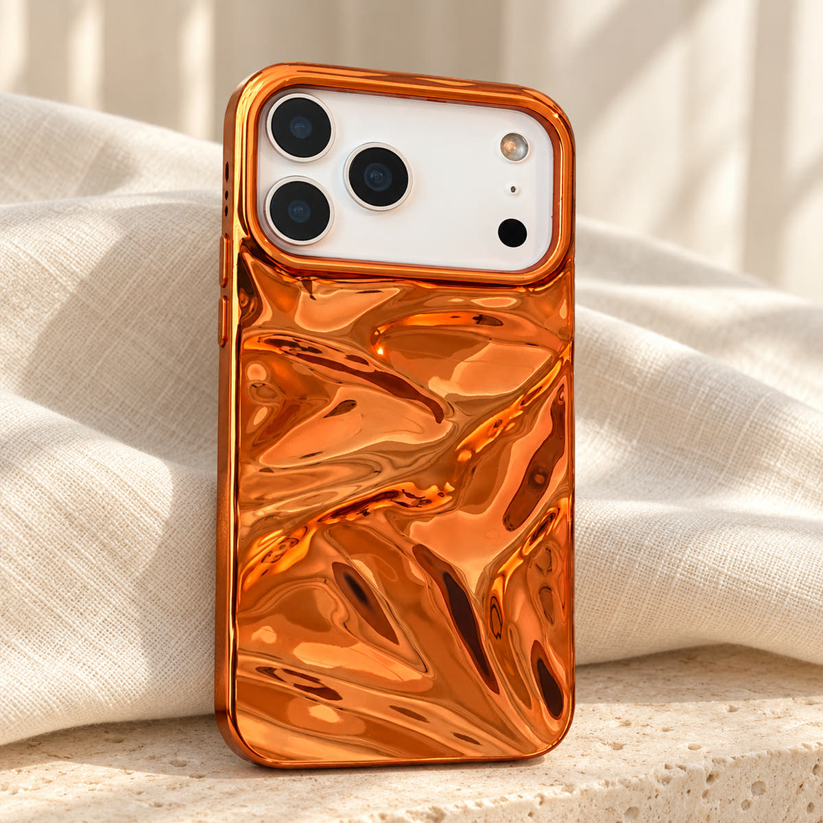 Copper-orange Chrome Wave iPhone case — linen flatlay view
