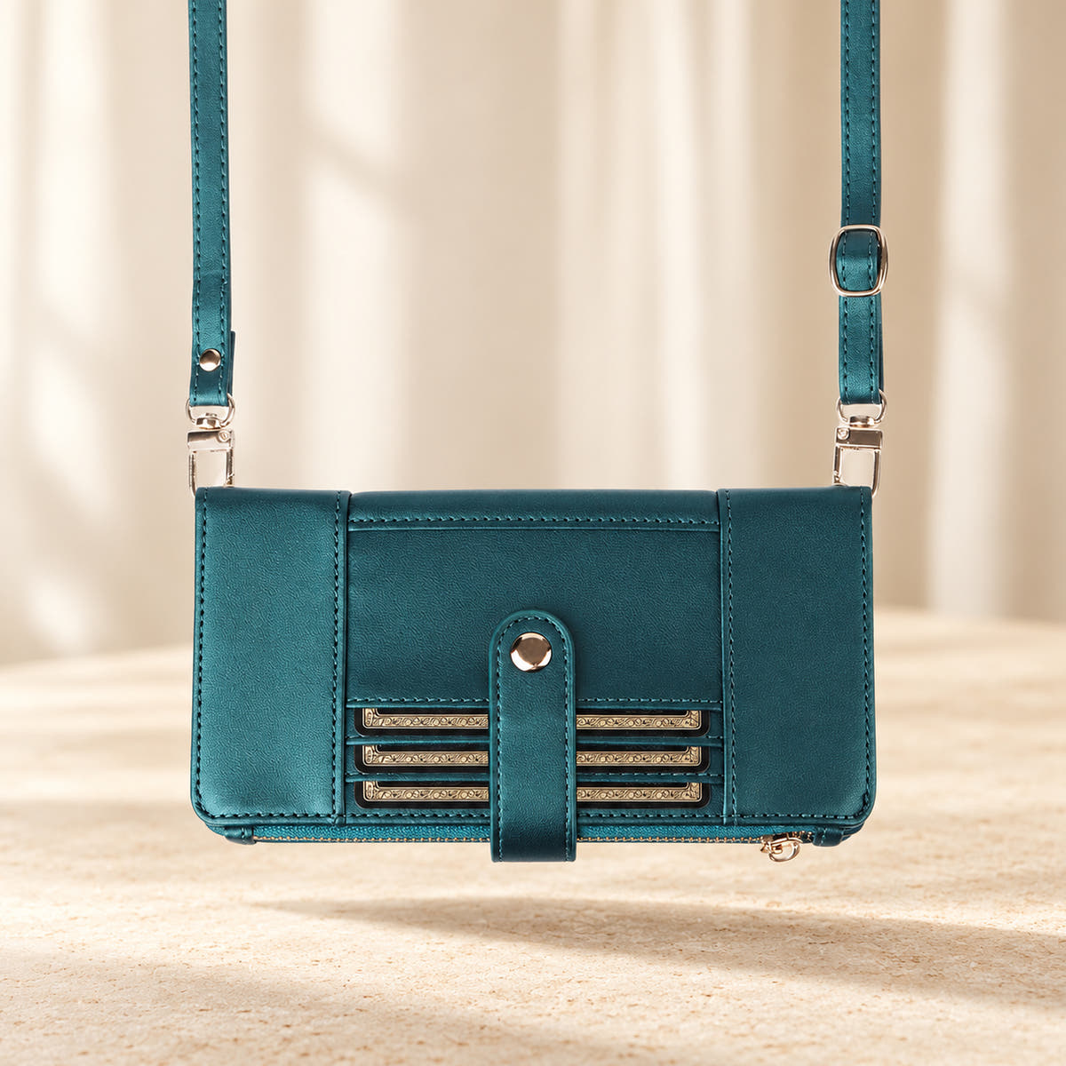 Elaris Crossbody iPhone wallet case in Forest Green, landscape view with adjustable crossbody strap.