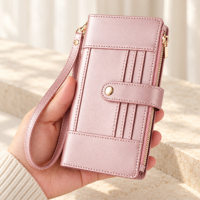 Elaris Crossbody iPhone wallet case in Pink, closed handheld view with wrist loop.