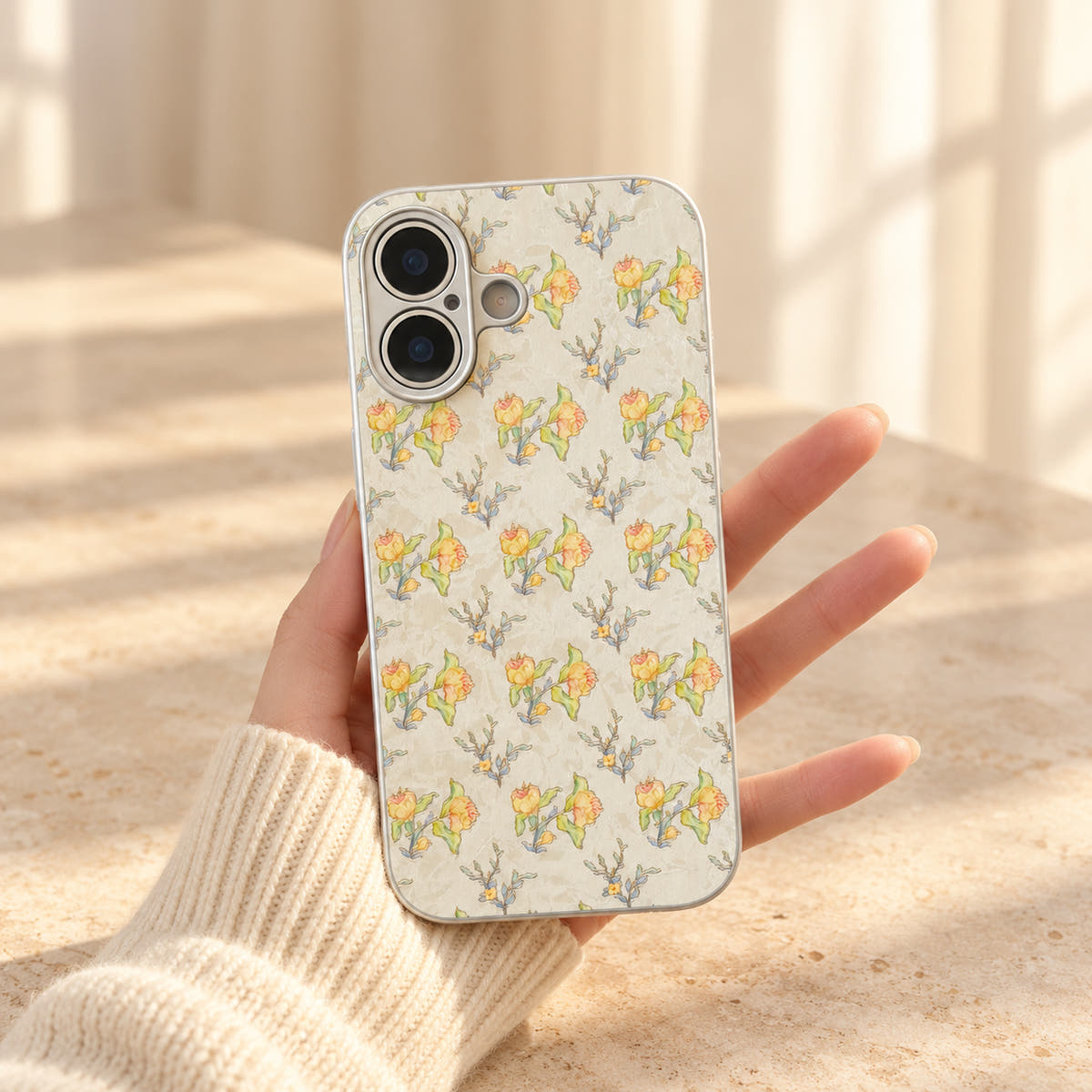 Yellow Elysia Floral case held with the wallet removed, revealing the complete floral print across the back.