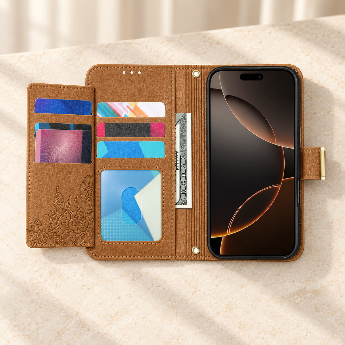 Brown floral iPhone wallet case opened to show the fold-out card flap, inner card slots, ID window, note compartment and fitted phone holder