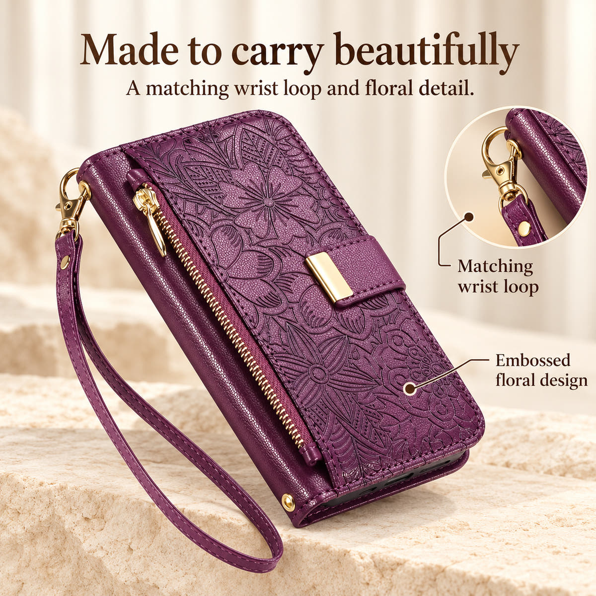 Purple floral iPhone wallet case feature image showing the matching wrist loop, gold-tone clip and embossed floral detail