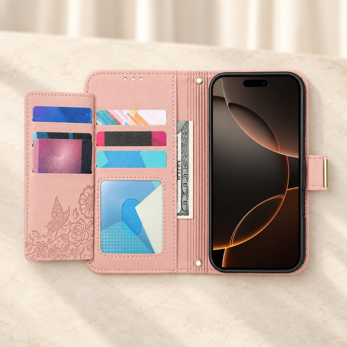 Pink floral iPhone wallet case opened to show the fold-out card flap, inner card slots, ID window, note compartment and fitted phone holder