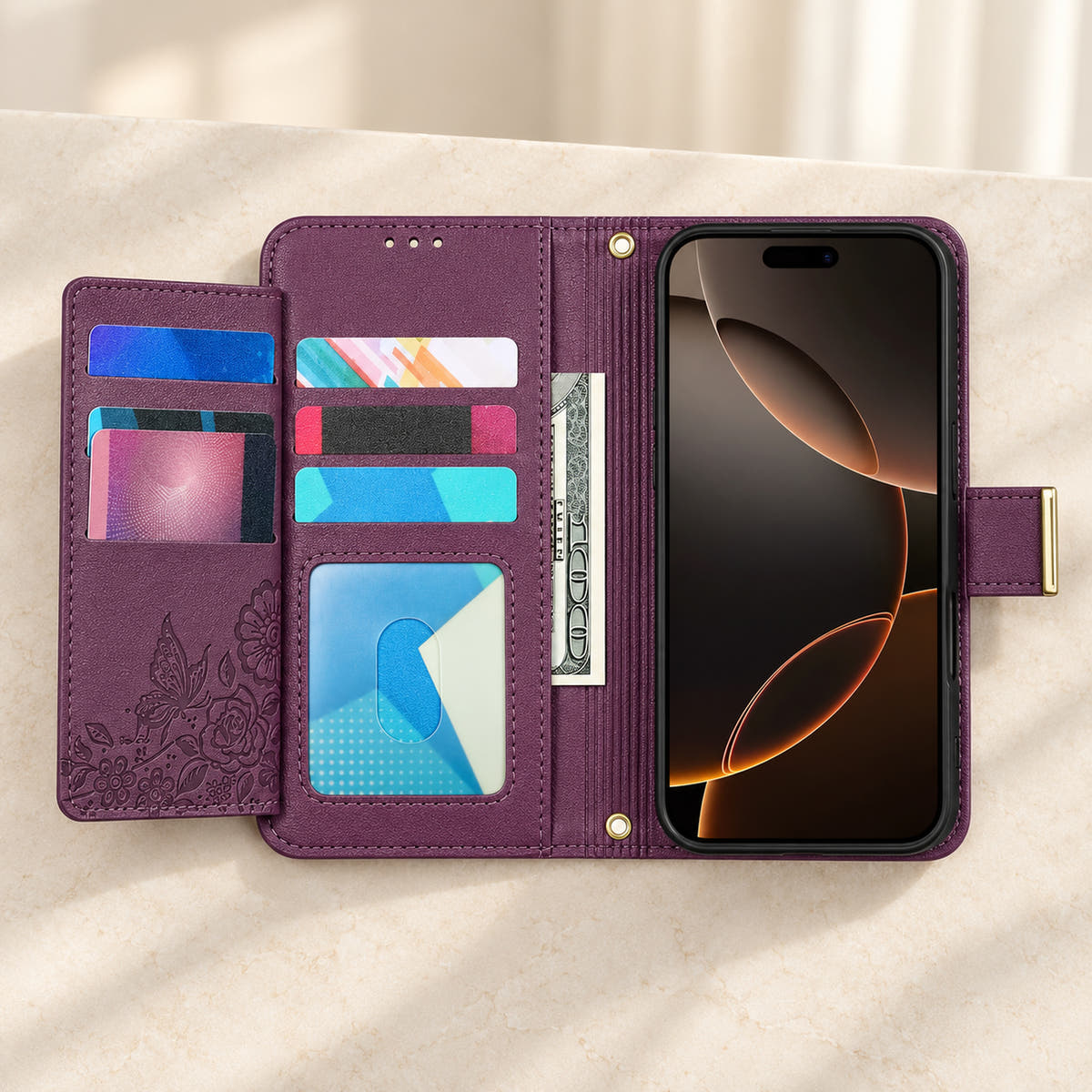 Purple floral iPhone wallet case opened to show the fold-out card flap, inner card slots, ID window, note compartment and fitted phone holder