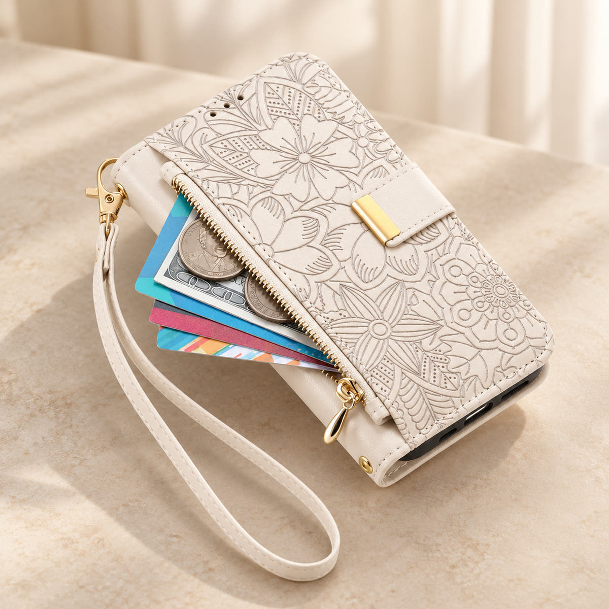White floral iPhone wallet case with the front zip pouch open, showing space for small essentials and the matching wrist strap