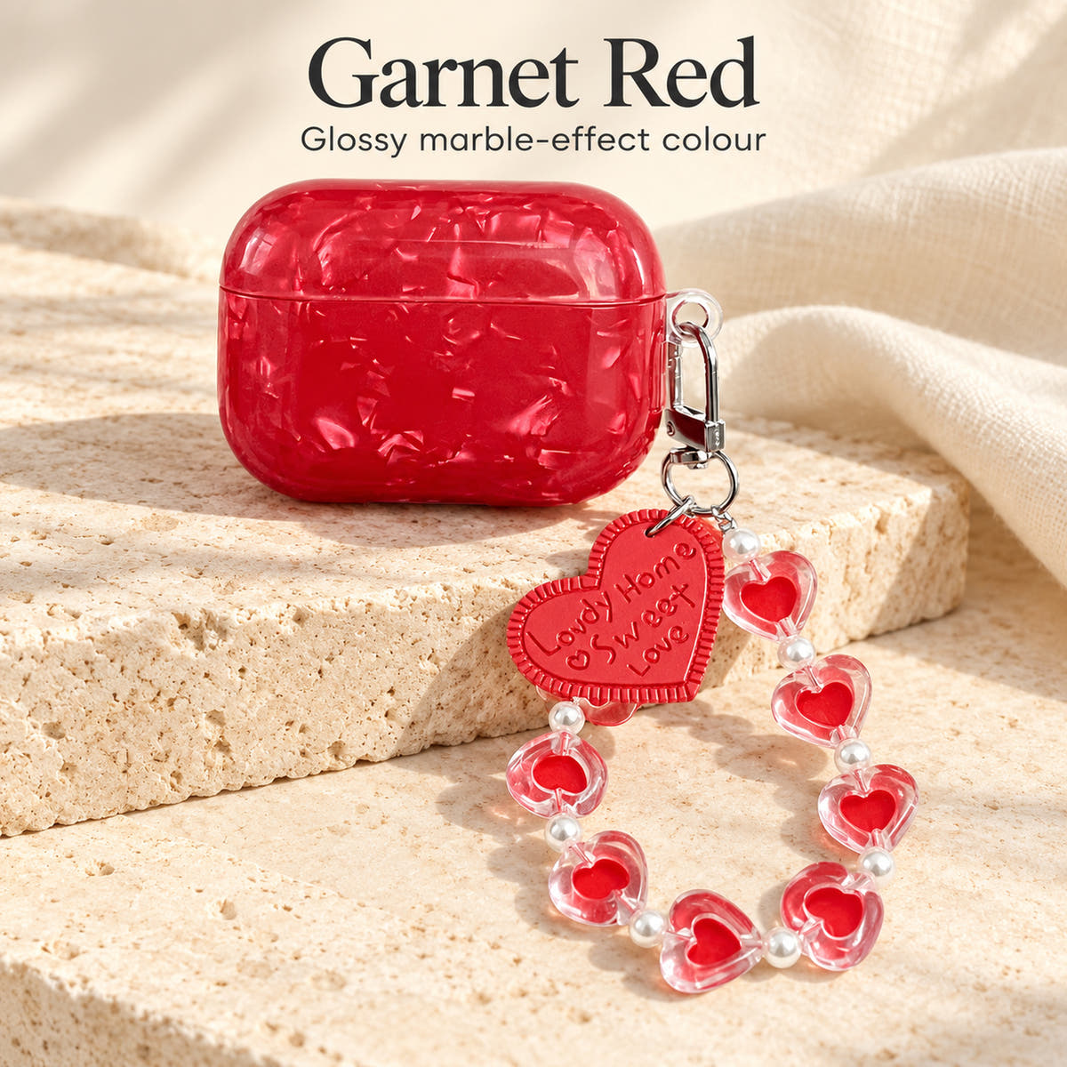 Garnet Marble AirPods case — colour guide with glossy red finish and heart-bead charm strap