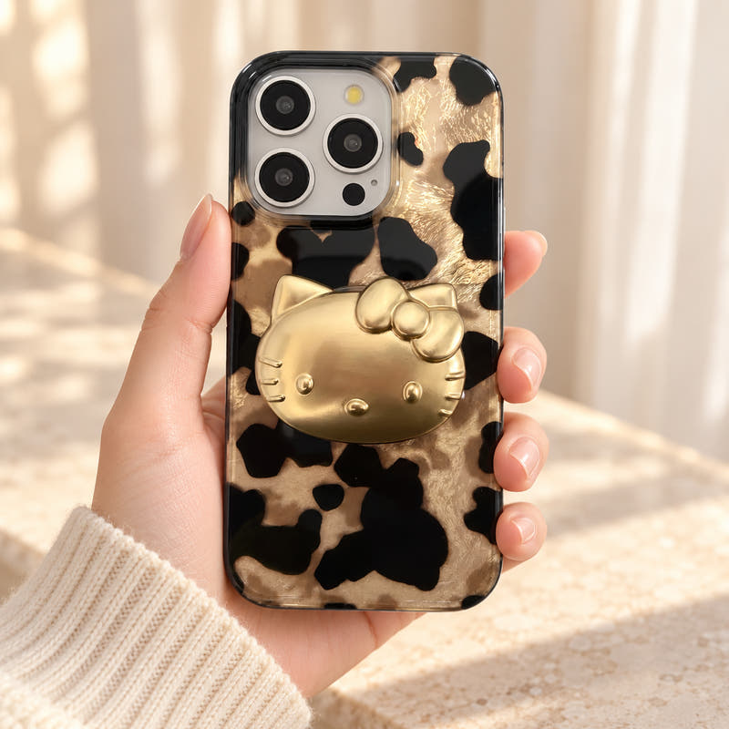 Glam Kitty case with kitty held in a cream-sleeved hand with the complete rear design visible.