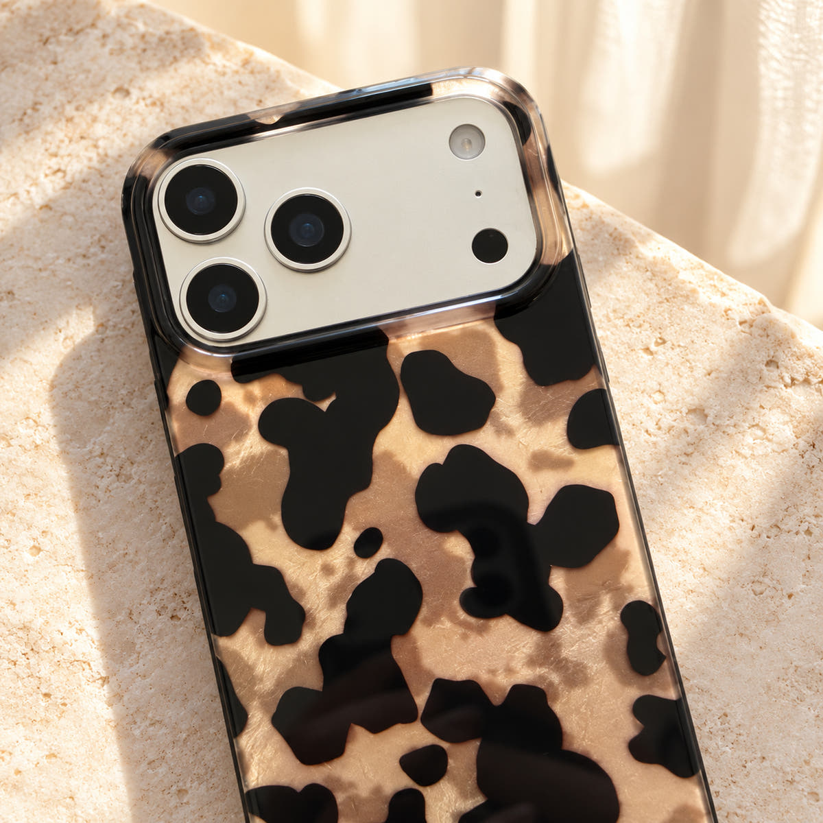 Glam Kitty case without kitty in a close-up showing the original camera opening and surrounding leopard print.