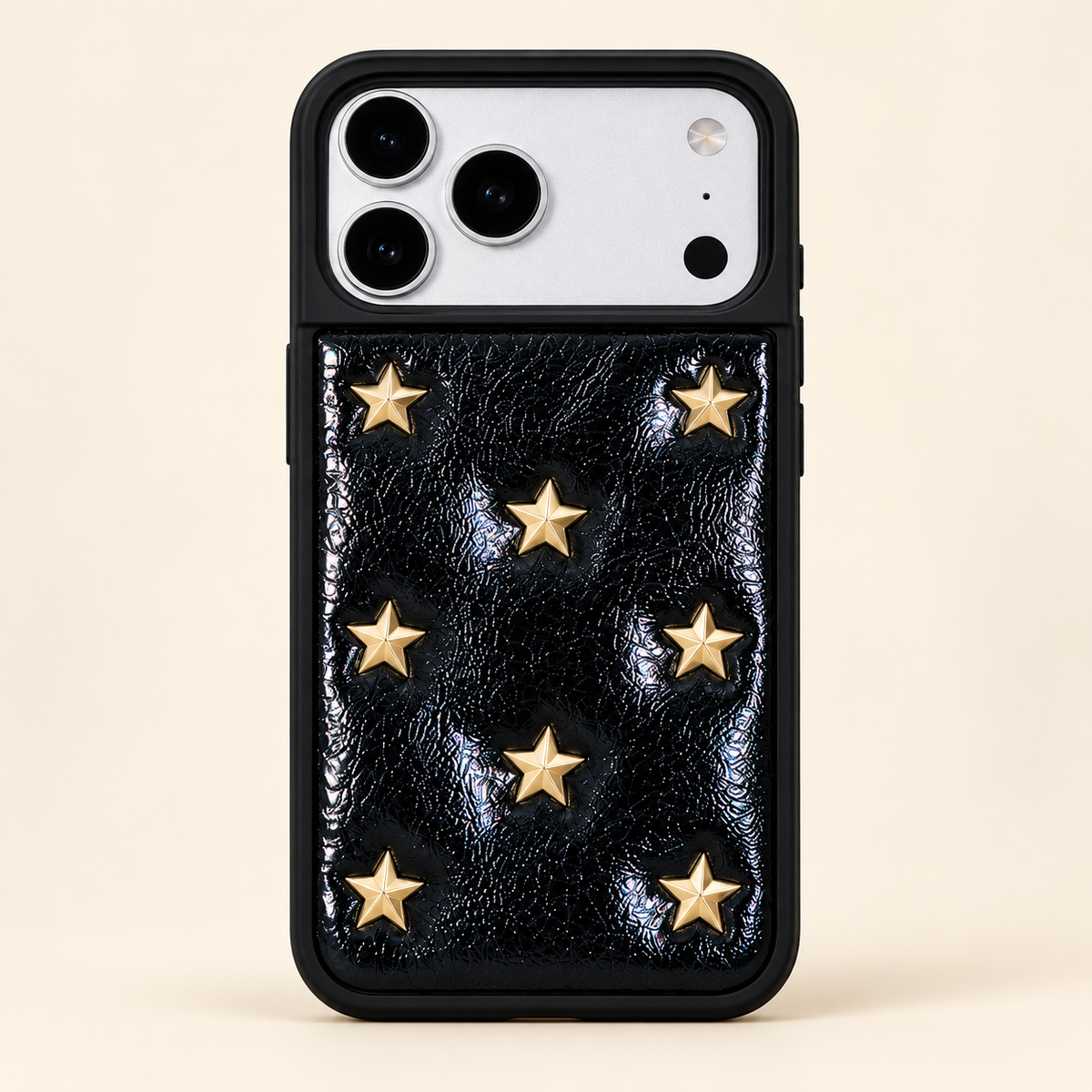 Black iPhone case with raised gold-tone stars — full rear studio view.