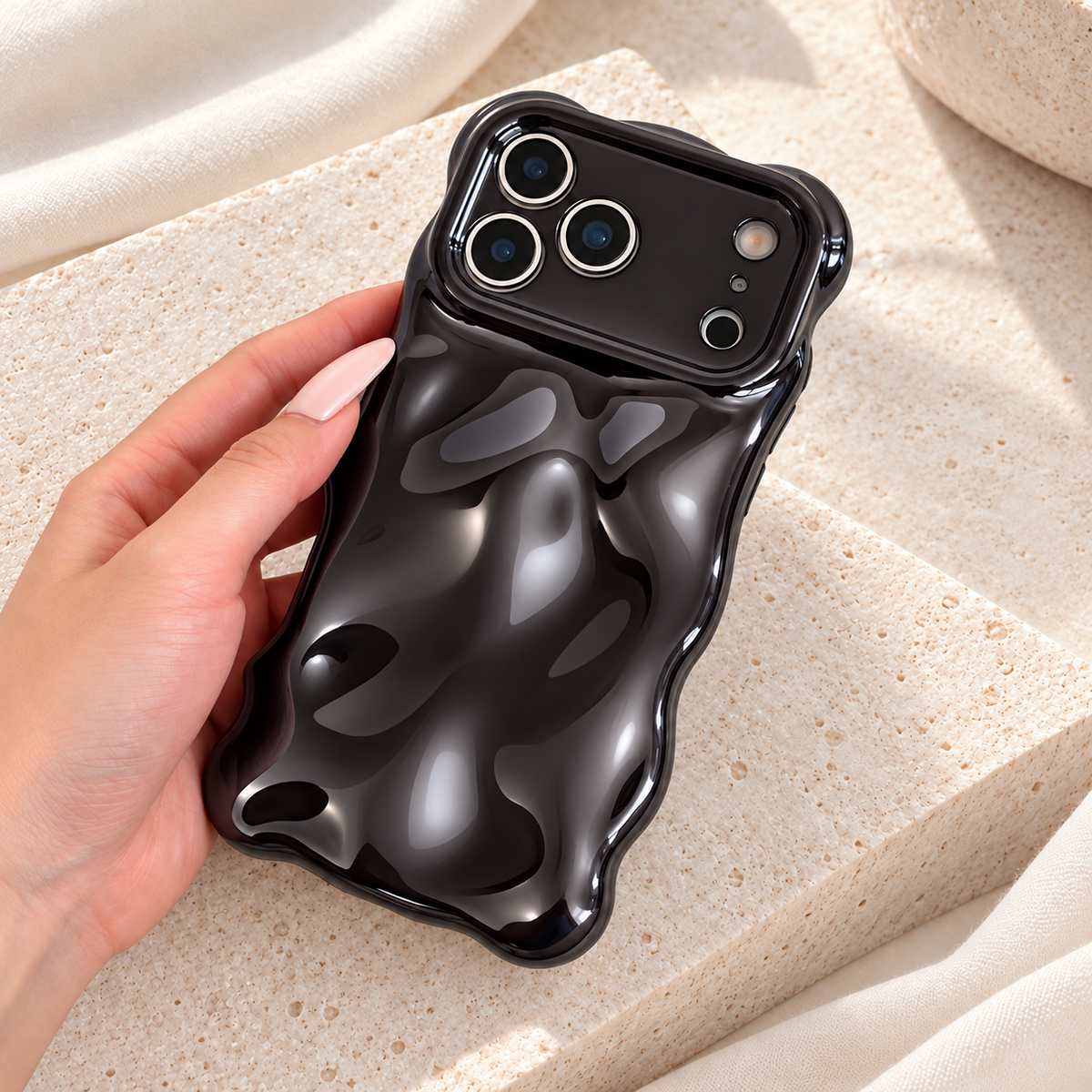 Liquid Chrome Wave iPhone case in Black shown in a natural lifestyle view.