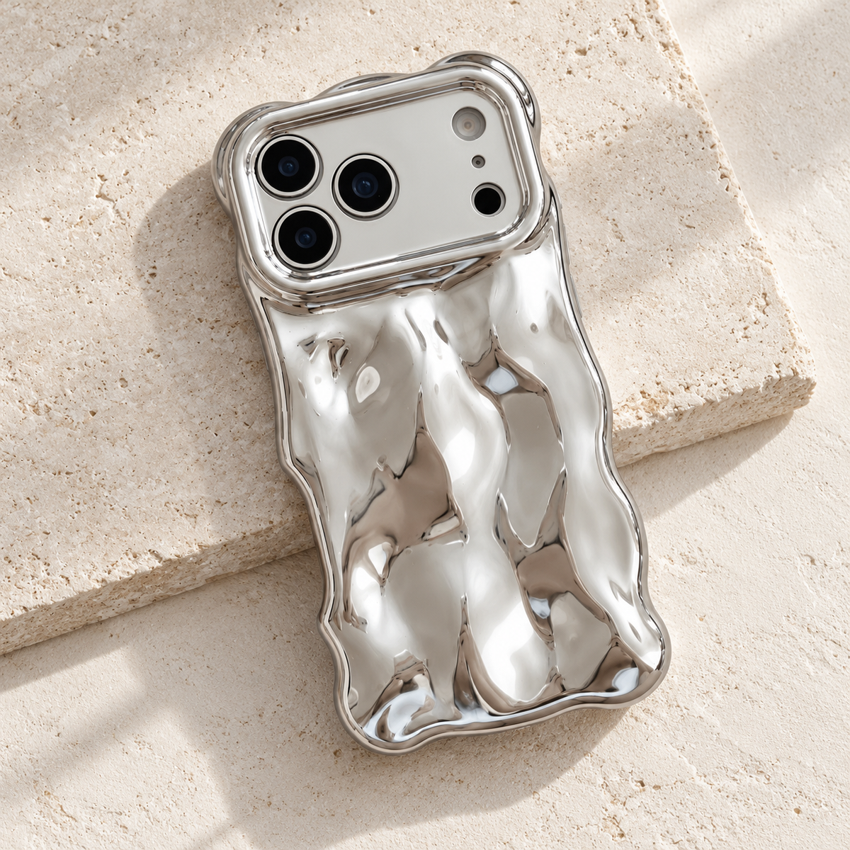 Diagonal flat-lay of the Silver Liquid Chrome Wave case showing its wavy outline.