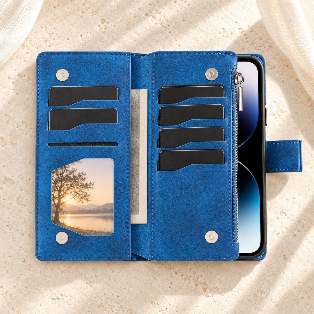 Lotus Mandala iPhone wallet case in Blue showing the foldout card panels, photo window and notes sleeve
