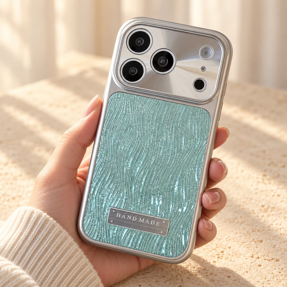Luna Belle textured shimmer iPhone case in Ice Blue, shown at a rear three-quarter angle.