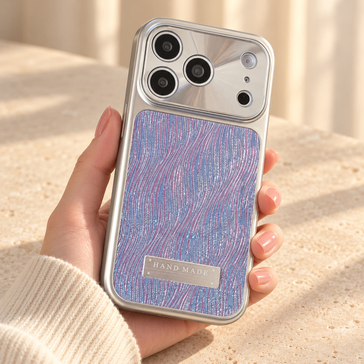 Luna Belle textured shimmer iPhone case in Purple, shown at a rear three-quarter angle.