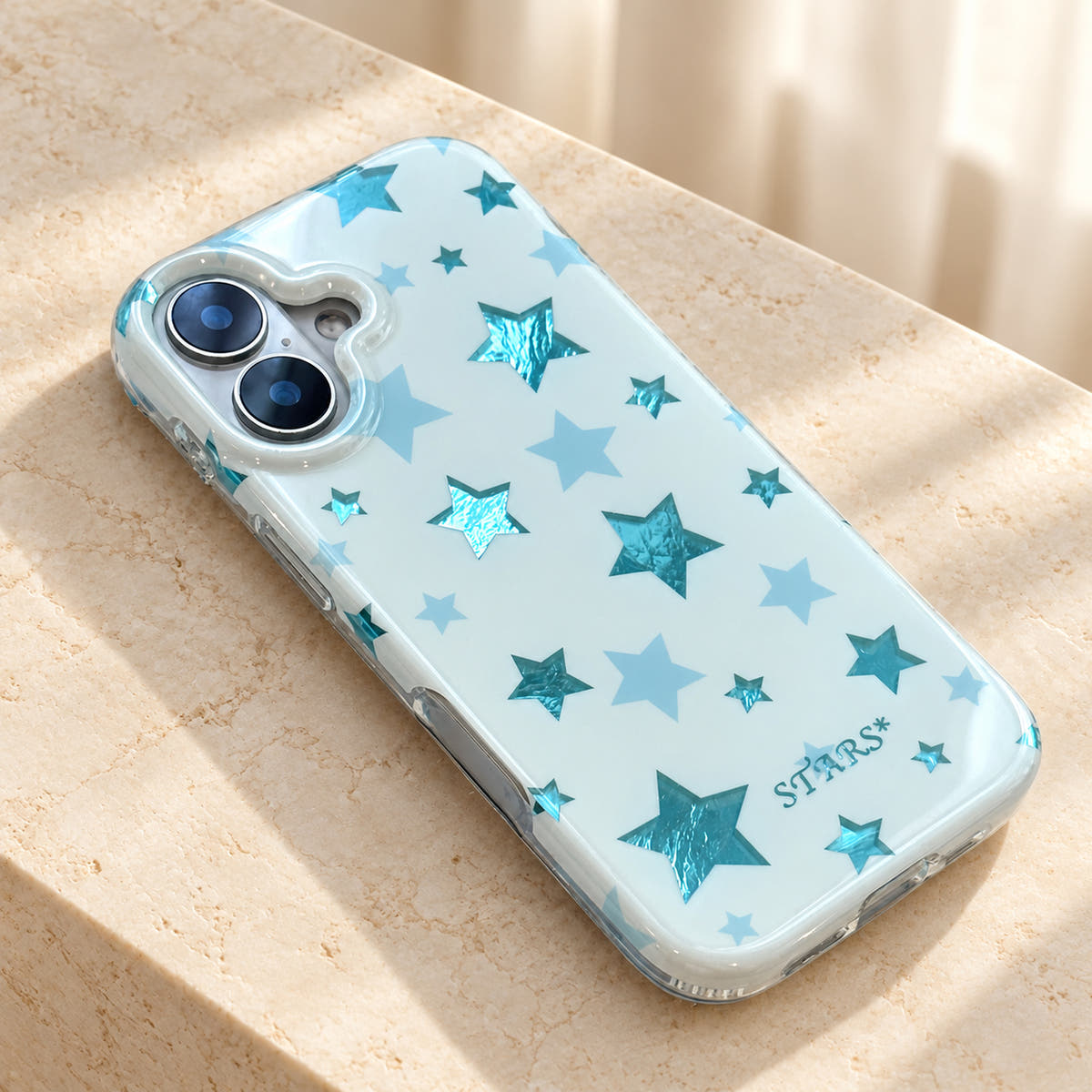Metallic Dots & Stars iPhone case in Blue — flatlay view