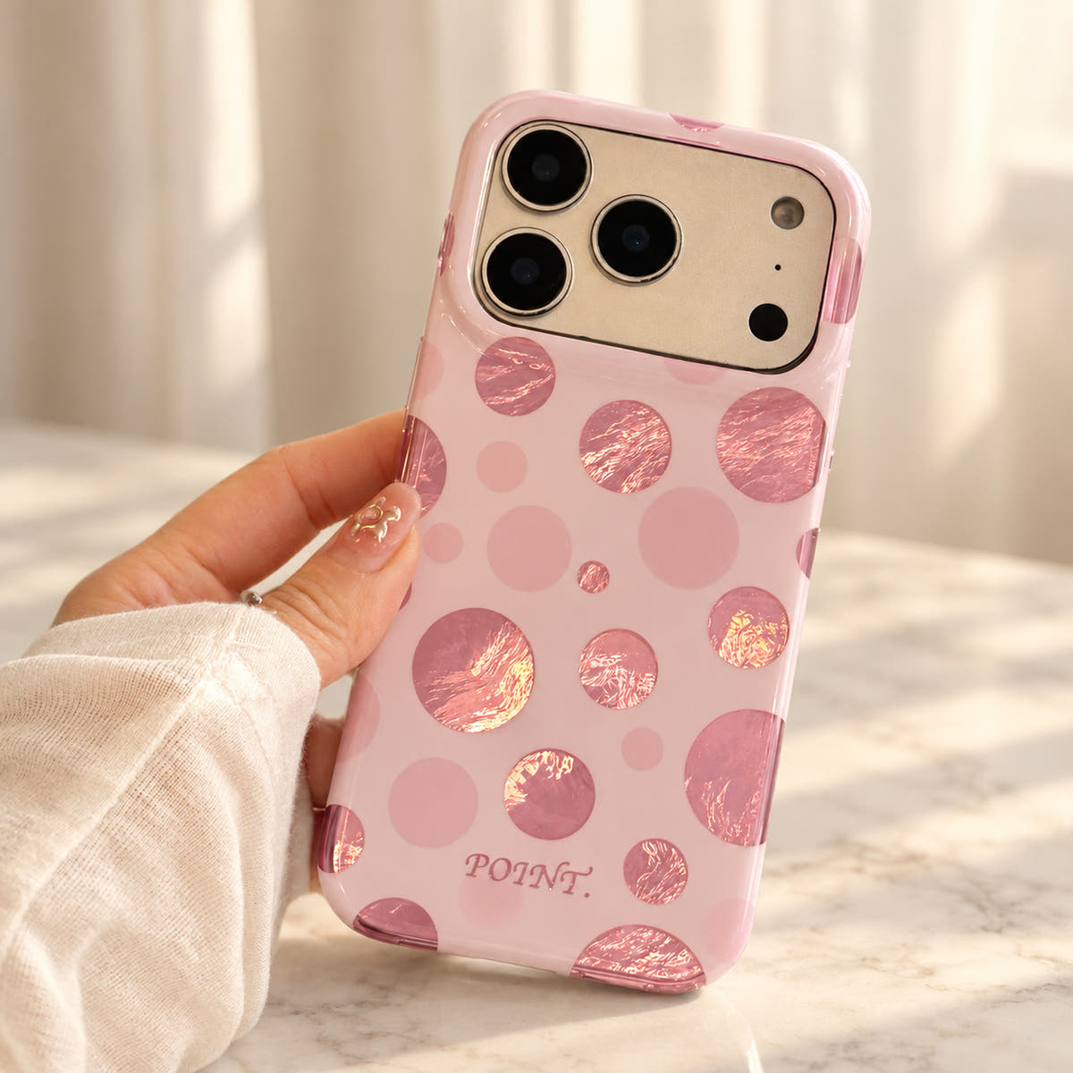 Metallic Dots & Stars iPhone case in Pink — handheld view