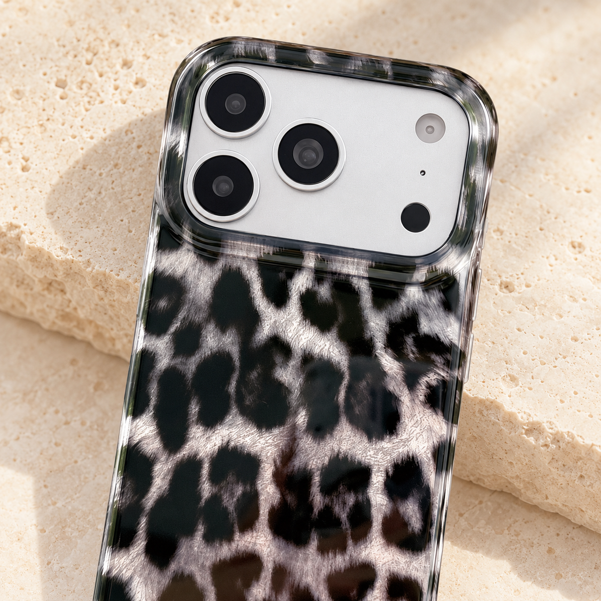 Upper leopard print detail beneath the case’s broad camera opening.