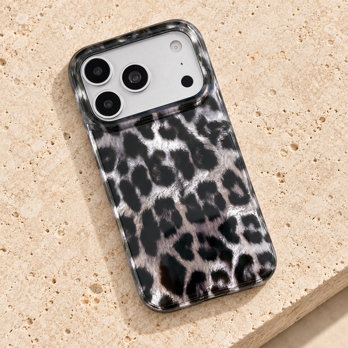 Overhead rear view of the case across a warm travertine slab.