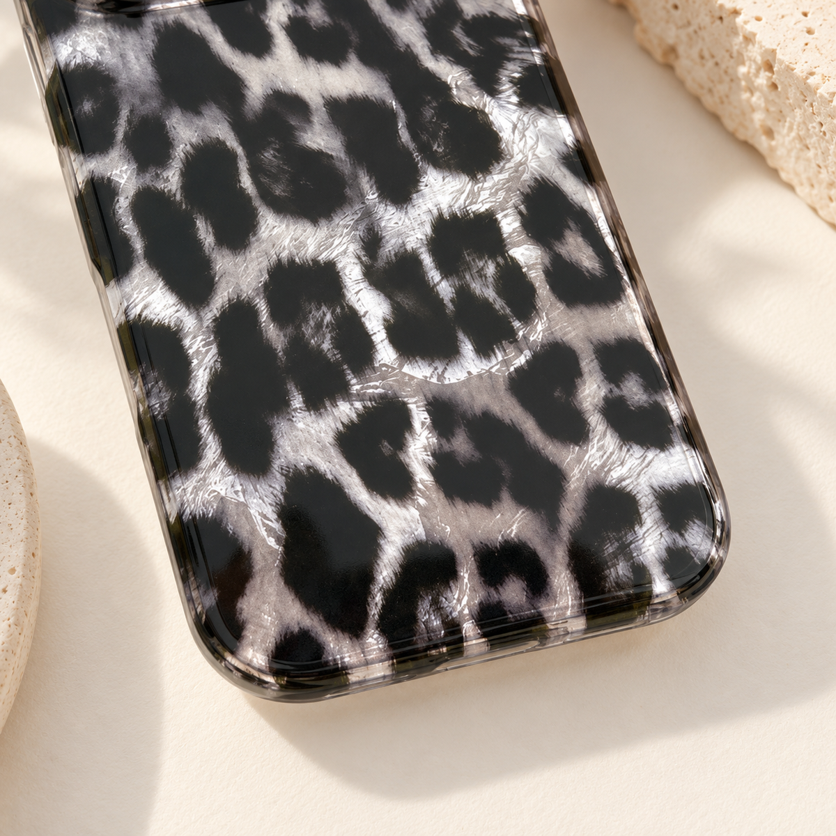 Lower leopard print and transparent rounded corner in a close tabletop view.
