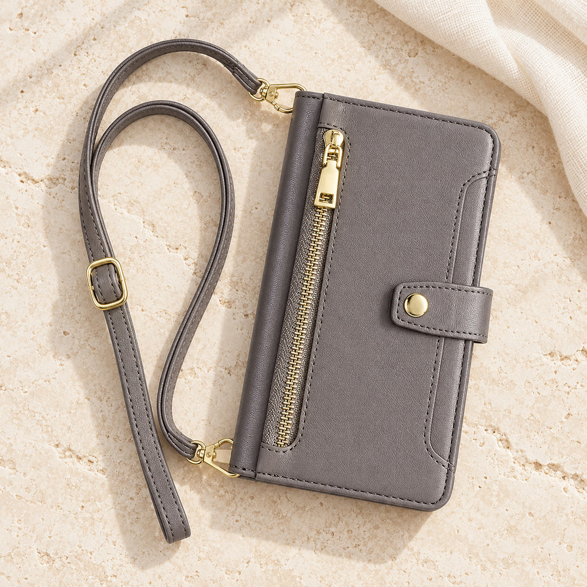 Minimal crossbody iPhone wallet case in Gray — overhead front view with matching adjustable shoulder strap