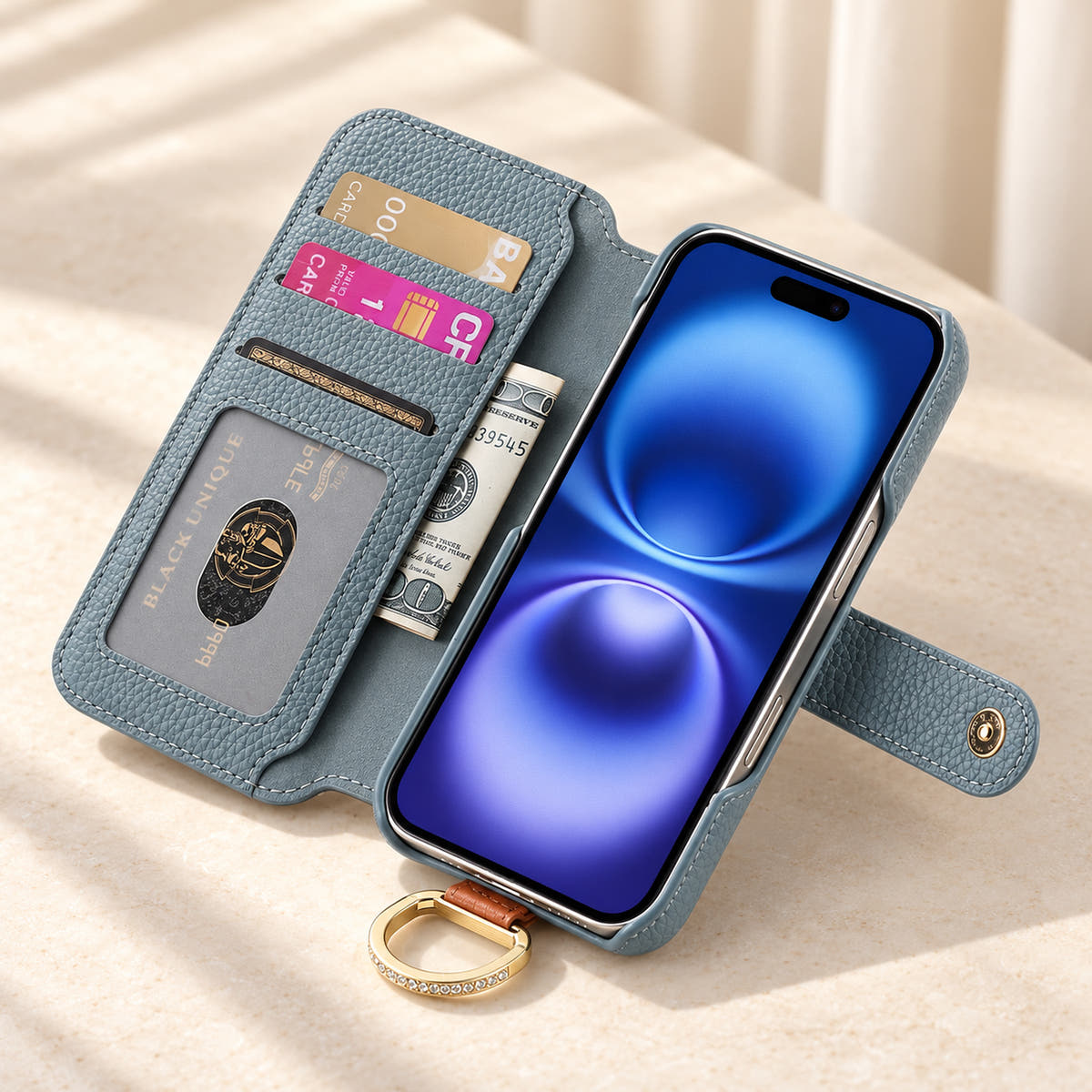 Blue iPhone wallet case opened to show three card slots, an ID window, a note pocket and the fitted phone holder