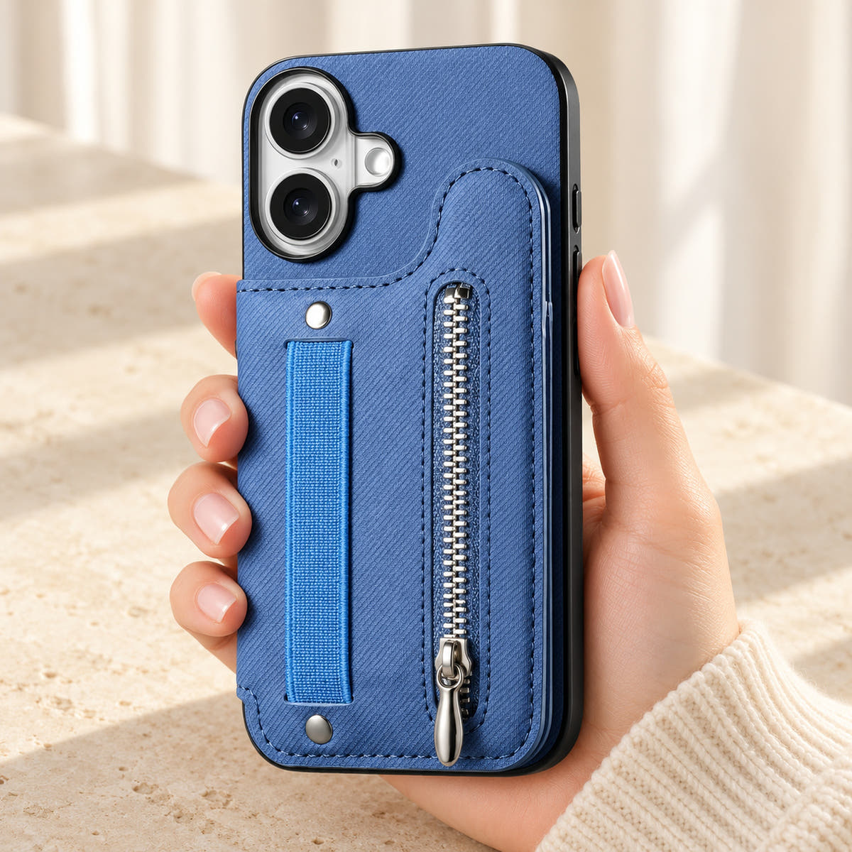 Multi-Pocket iPhone wallet case in Blue held upright, showing the rear wallet, fabric hand strap and silver zip